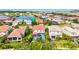 Wide aerial view of a neighborhood with various homes, ponds, and lush landscaping near a lake at 5823 Title Row Dr, Bradenton, FL 34210
