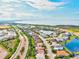 Aerial view of a residential neighborhood with a lake in the distance at 5823 Title Row Dr, Bradenton, FL 34210