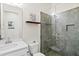 Modern bathroom featuring a glass-enclosed shower, white vanity, and contemporary fixtures at 5823 Title Row Dr, Bradenton, FL 34210