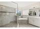 Bright bathroom featuring a glass shower, soaking tub and vanity with double sinks at 5823 Title Row Dr, Bradenton, FL 34210