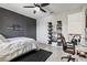 Spacious bedroom featuring decorative shelf with sneakers and black accent wall at 5823 Title Row Dr, Bradenton, FL 34210