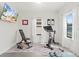 Bright exercise room featuring large windows, hard flooring, and exercise equipment at 5823 Title Row Dr, Bradenton, FL 34210