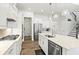 Spacious kitchen features stainless steel appliances, granite counters, and modern lighting at 5823 Title Row Dr, Bradenton, FL 34210