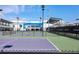 IMG Academy tennis court with a view of the tennis center under a bright blue sky at 5823 Title Row Dr, Bradenton, FL 34210