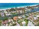 Aerial view of waterfront community with homes, pools, docks, and direct access to the ocean at 5920 Gulf Of Mexico Dr, Longboat Key, FL 34228