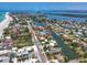 Stunning aerial view of coastal neighborhood with waterfront homes, docks, and ocean access at 5920 Gulf Of Mexico Dr, Longboat Key, FL 34228