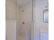 Shower with decorative stone tile and glass partition, modern fixtures and a modern mirror at 5920 Gulf Of Mexico Dr, Longboat Key, FL 34228