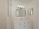 Bathroom features a shower with glass door, modern lighting, and a square framed mirror at 5920 Gulf Of Mexico Dr, Longboat Key, FL 34228