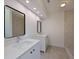 Bathroom featuring dual sinks with quartz countertops, modern fixtures, and recessed lighting at 5920 Gulf Of Mexico Dr, Longboat Key, FL 34228