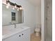 Bathroom featuring a modern vanity, vessel sink, modern lighting and a shower with tile at 5920 Gulf Of Mexico Dr, Longboat Key, FL 34228