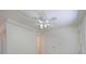 Bright room with white walls, ceiling fan, interior door, and view into adjacent room at 5920 Gulf Of Mexico Dr, Longboat Key, FL 34228