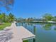 Private dock providing direct access to the calm canal waters, perfect for boating and relaxation at 5920 Gulf Of Mexico Dr, Longboat Key, FL 34228