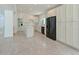 Bright, open kitchen features white cabinetry, modern appliances, and a convenient center island at 5920 Gulf Of Mexico Dr, Longboat Key, FL 34228
