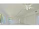 Bright and airy living area with large windows, ceiling fans, and ample space for furniture arrangement at 5920 Gulf Of Mexico Dr, Longboat Key, FL 34228