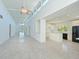 Bright and airy living space with high ceilings, modern lighting, and seamless flow to the kitchen at 5920 Gulf Of Mexico Dr, Longboat Key, FL 34228