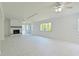 Open living area with fireplace, tile floors, and bright windows, ideal for relaxation and entertainment at 5920 Gulf Of Mexico Dr, Longboat Key, FL 34228