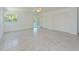 Bright living room with terrazzo floors, white walls and lots of natural light at 5920 Gulf Of Mexico Dr, Longboat Key, FL 34228