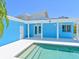 Covered outdoor pool with architectural columns, steps into the water and a neutral concrete deck at 5920 Gulf Of Mexico Dr, Longboat Key, FL 34228
