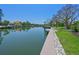Waterfront property featuring a dock and easy access to the canal, surrounded by lush greenery and landscaping at 5920 Gulf Of Mexico Dr, Longboat Key, FL 34228