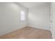 Bright bedroom with hardwood flooring, plantation shutters, and ample natural light at 5987 Snowy Egret Dr, Sarasota, FL 34238