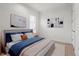 Well lit primary bedroom featuring hardwood floors, plantation shutters, and neutral colors at 5987 Snowy Egret Dr, Sarasota, FL 34238