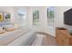 Bedroom with hardwood flooring, plantation shutters, and natural light for a cozy atmosphere at 5987 Snowy Egret Dr, Sarasota, FL 34238