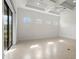 Bonus room with tile floors, recessed lighting and views to the outside at 5987 Snowy Egret Dr, Sarasota, FL 34238