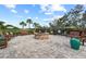Inviting outdoor fire pit area with comfortable seating, creating a cozy and relaxing atmosphere at 5987 Snowy Egret Dr, Sarasota, FL 34238