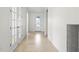 Hallway featuring tile floors and clear sight lines at 5987 Snowy Egret Dr, Sarasota, FL 34238