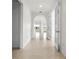 Hallway featuring neutral tile flooring and open concept at 5987 Snowy Egret Dr, Sarasota, FL 34238
