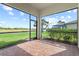 Screened lanai with a beautiful view of the lake and backyard at 5987 Snowy Egret Dr, Sarasota, FL 34238