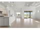 Open-concept living space with modern features and view to screened patio and backyard at 5987 Snowy Egret Dr, Sarasota, FL 34238
