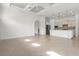 Open-concept living area with gourmet kitchen and lots of natural light at 5987 Snowy Egret Dr, Sarasota, FL 34238