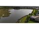 Picturesque pond view surrounded by lush greenery, offering a tranquil and scenic environment at 5987 Snowy Egret Dr, Sarasota, FL 34238