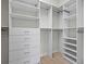 Spacious walk-in closet featuring custom shelving and ample storage space at 5987 Snowy Egret Dr, Sarasota, FL 34238