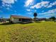 Extensive backyard with screened in porch and lush lawn at 6113 Mckee St, Port Charlotte, FL 33981