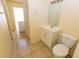 Functional bathroom featuring a single vanity, toilet, and walk-in shower at 6113 Mckee St, Port Charlotte, FL 33981