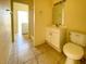 Functional bathroom featuring a single vanity, toilet, and walk-in shower at 6113 Mckee St, Port Charlotte, FL 33981
