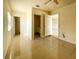 Spacious bedroom with neutral walls and easy access to an ensuite bathroom at 6113 Mckee St, Port Charlotte, FL 33981