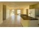 Bright living room featuring an open floor plan and a breakfast bar, perfect for entertaining at 6113 Mckee St, Port Charlotte, FL 33981