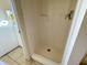 Bathroom features a stand-up shower stall with a single faucet and white door frame at 6113 Mckee St, Port Charlotte, FL 33981