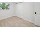 Bedroom with wood-look floors, a window, and a closet for storage at 612 65Th W Ave, Bradenton, FL 34207
