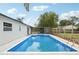 Backyard pool with screened in patio and fenced yard at 612 65Th W Ave, Bradenton, FL 34207
