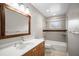 Bathroom with a sink, white countertop, and a shower-tub combo at 6512 Bowline Dr, Sarasota, FL 34231