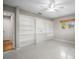 A bedroom with a built-in bookshelf and a window at 6512 Bowline Dr, Sarasota, FL 34231