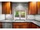 This stylish kitchen offers stainless steel appliances, custom cabinetry, and granite countertops for a modern look at 6512 Bowline Dr, Sarasota, FL 34231