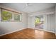Bright living room with hardwood floors and sliding glass doors to the outdoor patio at 6512 Bowline Dr, Sarasota, FL 34231