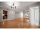 Open-concept living room features hardwood floors, recessed lighting, and a seamless transition to other areas of the home at 6512 Bowline Dr, Sarasota, FL 34231