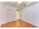 Neat bedroom with hardwood floors and a large closet, providing ample storage at 6519 Grand Estuary Trl # 107, Bradenton, FL 34212