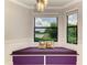 Cozy breakfast nook with scenic views of the golf course and lake, featuring a cushioned bench at 6519 Grand Estuary Trl # 107, Bradenton, FL 34212